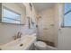 Bathroom with a shower, natural light, and a traditional sink at 5713 Saint Louis Ave, Sarasota, FL 34233