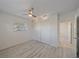 Bedroom with ceiling fan, closet and new laminate floors at 5713 Saint Louis Ave, Sarasota, FL 34233