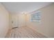 Bright bedroom with hardwood flooring, natural light, and neutral paint creating a welcoming atmosphere at 5713 Saint Louis Ave, Sarasota, FL 34233