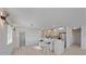 Kitchen island with white shaker cabinets, butcher block counters and pendant lights at 5713 Saint Louis Ave, Sarasota, FL 34233