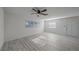 Bright living room with lots of natural light and new laminate floors at 5713 Saint Louis Ave, Sarasota, FL 34233