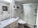 Modern bathroom features a marble vanity, sleek fixtures, and a glass-enclosed walk-in shower at 5855 Midnight Pass Rd # 233, Sarasota, FL 34242