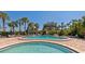 Enjoy the community pool with lounge chairs and shade, perfect for relaxation at 5855 Midnight Pass Rd # 233, Sarasota, FL 34242