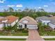 Aerial view of a single-Gathering home in a residential neighborhood at 5892 Semolino St, Nokomis, FL 34275