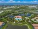 Aerial view of community pool, tennis courts, and clubhouse at 5892 Semolino St, Nokomis, FL 34275