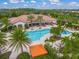 Resort-style pool with lounge chairs and umbrellas at 5892 Semolino St, Nokomis, FL 34275