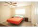 Bright bedroom with ceiling fan and neutral decor at 603 Saint Andrews Dr, Sarasota, FL 34243