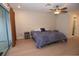 Main bedroom with light wood floors, a ceiling fan and sliding glass doors at 603 Saint Andrews Dr, Sarasota, FL 34243