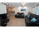 Living room with hardwood floors, recliners, and a ship wheel at 603 Saint Andrews Dr, Sarasota, FL 34243