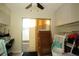 Home office with sliding door, desk, and crib at 603 Saint Andrews Dr, Sarasota, FL 34243