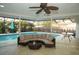 Relaxing pool area with covered patio and wicker furniture at 603 Saint Andrews Dr, Sarasota, FL 34243