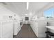 Shared laundry room with multiple washers and dryers at 6091 Coral Way, Bradenton, FL 34207