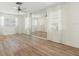 Living room with hardwood floors and mirrored accent wall at 6091 Coral Way, Bradenton, FL 34207