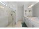 Spa-like bathroom with a large shower and double vanity at 6240 Fish Eagle Ct, Nokomis, FL 34275