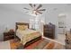 Bedroom with ceiling fan, ensuite bathroom, and laundry access at 6240 Fish Eagle Ct, Nokomis, FL 34275