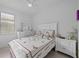 Charming bedroom with white furniture and a comfy bed at 6240 Fish Eagle Ct, Nokomis, FL 34275