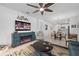 Living room with built-in electric fireplace and view into kitchen and dining area at 6240 Fish Eagle Ct, Nokomis, FL 34275