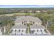 Aerial view of condo community showcasing building, landscaping, and golf course views at 6334 Grand Oak Cir # 201, Bradenton, FL 34203