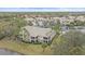 Aerial view of condo building near water at 6334 Grand Oak Cir # 201, Bradenton, FL 34203