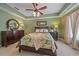 Spacious bedroom with ensuite bath and leafy green views at 6334 Grand Oak Cir # 201, Bradenton, FL 34203