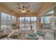 Spacious screened-in porch with lake views and comfortable seating at 6334 Grand Oak Cir # 201, Bradenton, FL 34203