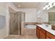 Main bathroom with a soaking tub, shower, and double vanity at 6814 Willowshire Way, Bradenton, FL 34212