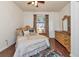 Guest bedroom with wood floors and a dresser at 6814 Willowshire Way, Bradenton, FL 34212