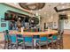 Upscale community bar with granite countertop and teal accents at 6814 Willowshire Way, Bradenton, FL 34212