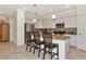 Modern kitchen with stainless steel appliances and an island at 6814 Willowshire Way, Bradenton, FL 34212