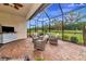 Spacious screened patio with fire pit and outdoor seating at 6814 Willowshire Way, Bradenton, FL 34212