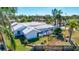 Backyard view of a house with pool and screened enclosure at 6851 Country Lakes Cir, Sarasota, FL 34243