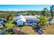 Backyard view of a house with pool and screened enclosure at 6851 Country Lakes Cir, Sarasota, FL 34243