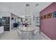 Modern dining area with a round table and chairs near the kitchen at 6851 Country Lakes Cir, Sarasota, FL 34243