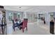 Modern dining room with a water feature and tiled floors at 6851 Country Lakes Cir, Sarasota, FL 34243