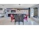 Modern dining room with dark wood cabinets and seating for four at 6851 Country Lakes Cir, Sarasota, FL 34243