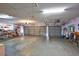 Spacious garage with ample storage shelving at 6851 Country Lakes Cir, Sarasota, FL 34243