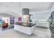 Modern kitchen with island, stainless steel appliances, and white cabinetry at 6851 Country Lakes Cir, Sarasota, FL 34243