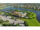 Aerial view of community with pool, tennis courts, and clubhouse at 6868 Wild Lake Ter, Bradenton, FL 34212