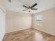 Bedroom with wood-look floors and ceiling fan at 6868 Wild Lake Ter, Bradenton, FL 34212