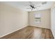 Bedroom with wood-look floors and ceiling fan at 6868 Wild Lake Ter, Bradenton, FL 34212