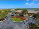 Community clubhouse with circular driveway and landscaping at 6868 Wild Lake Ter, Bradenton, FL 34212