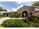 Community clubhouse entrance with landscaping at 6868 Wild Lake Ter, Bradenton, FL 34212