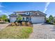 Two-story house with stone accents, three-car garage, and landscaped yard at 6868 Wild Lake Ter, Bradenton, FL 34212