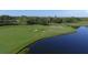 Aerial view of the golf course with water features at 6868 Wild Lake Ter, Bradenton, FL 34212