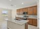 Modern kitchen with stainless steel appliances and granite countertops at 6868 Wild Lake Ter, Bradenton, FL 34212