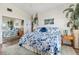 Spacious bedroom with mirrored closet and floral bedding at 713 Harrington Lake N Dr # 18, Venice, FL 34293