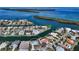 Aerial view of waterfront home with private dock and canal access at 721 Old Compass Rd, Longboat Key, FL 34228