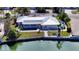 Waterfront home with private pool and dock; aerial view at 721 Old Compass Rd, Longboat Key, FL 34228