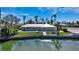 Waterfront home showcasing its backyard and canal access at 721 Old Compass Rd, Longboat Key, FL 34228