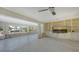 Large living area with built-in shelving and large TV at 721 Old Compass Rd, Longboat Key, FL 34228